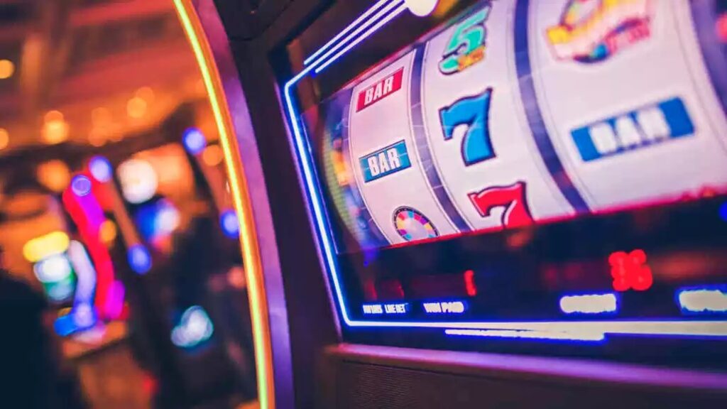 Playing Slot Machines with a Three-Reel Strategy